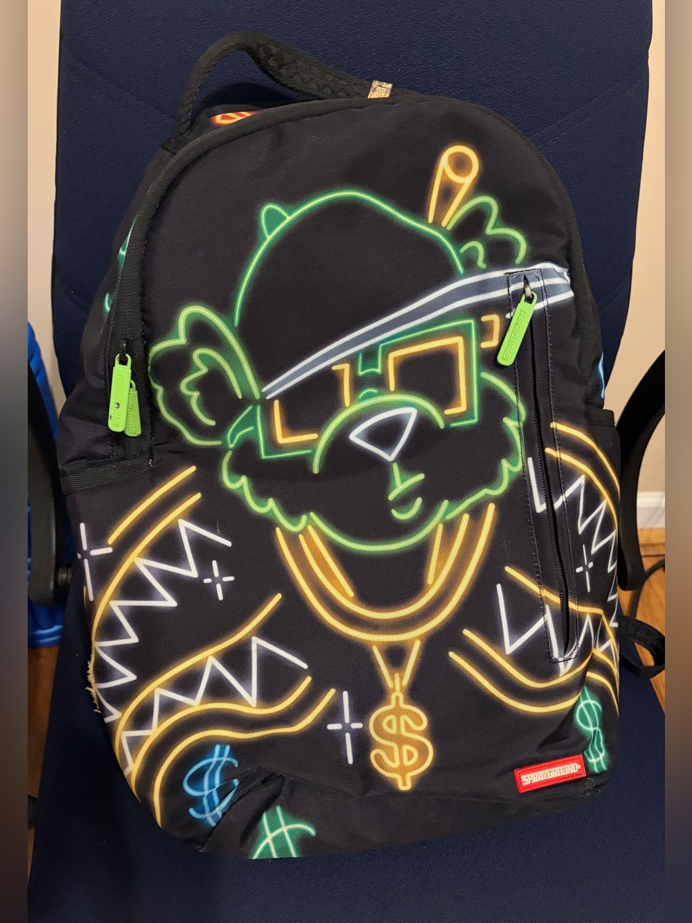 Sprayground Black Backpack with Neon Green, Gold & Blue Dollar Graphics